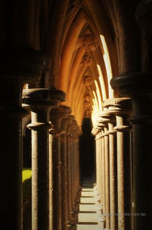 Play of light on the pillars surrounding the cloister, Mont Saint Michel, France
