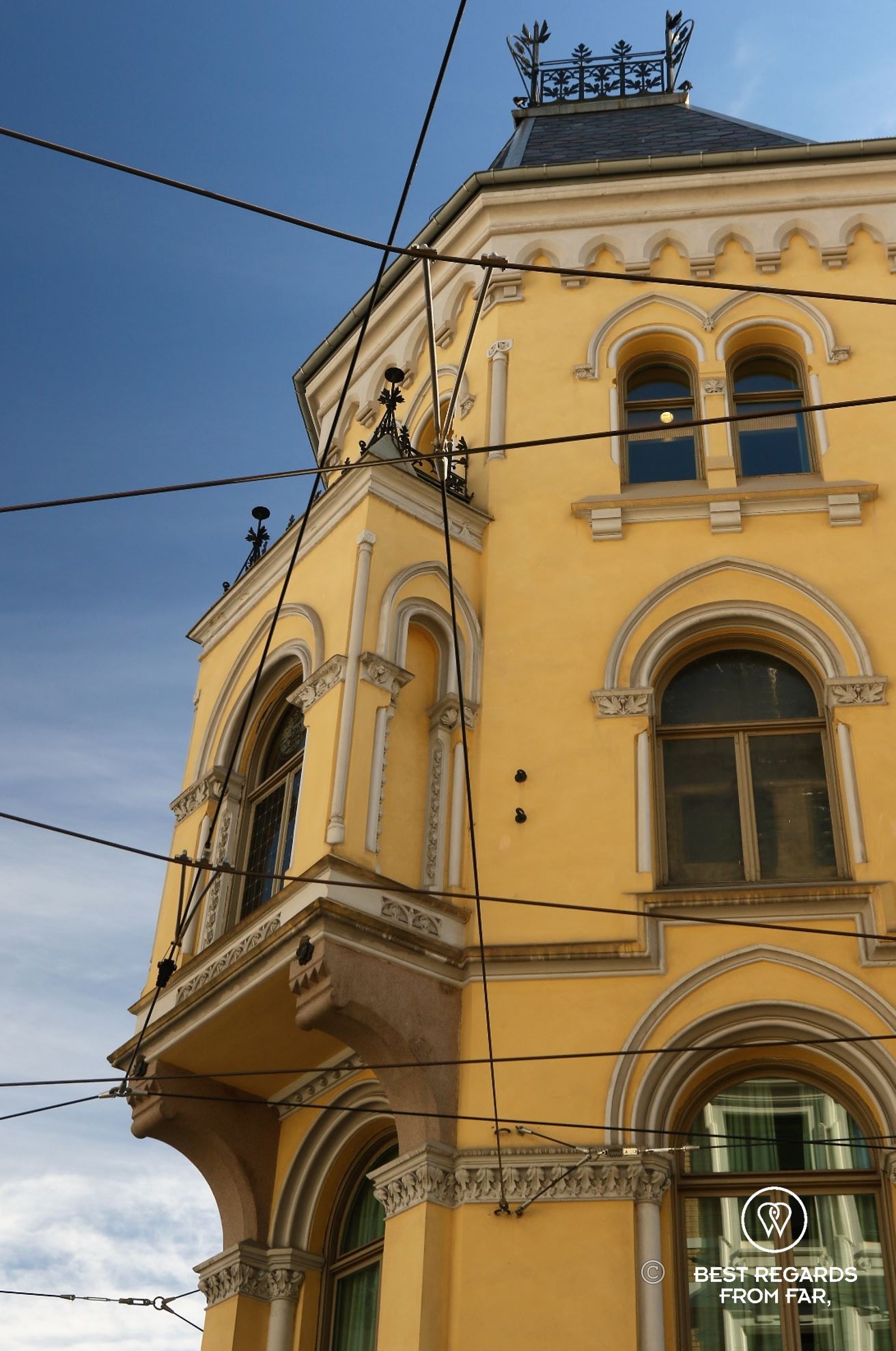 Classy yellow building, tram lines and blue skies, Oslo, Norway