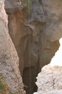 200-meter long ropes hanging into the Seventh Hole Cave in Oman.