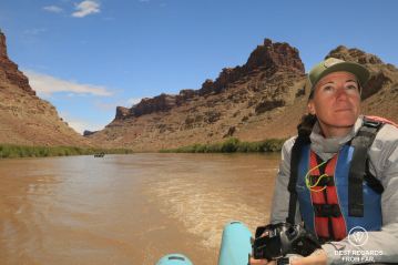 Photographer Claire Lessiau while rafting the Cataract Canyon section of the Colorado River.