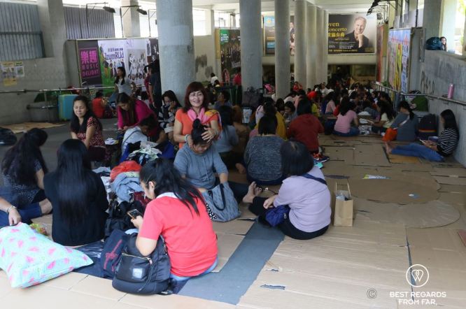 The precarious condition of domestic workers in Hong Kong relaxing underground on Sundays