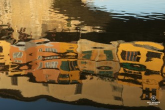 Reflections of Ponte Vecchio in the Arno River, Florence, Italy