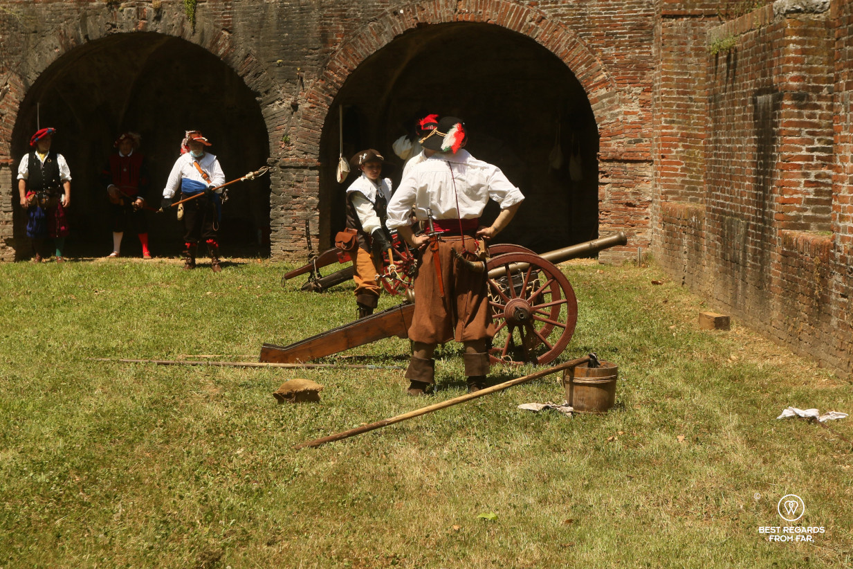 Men in period costumes firing the canons for the Saint Paolino celebrations in Lucca, Italy.