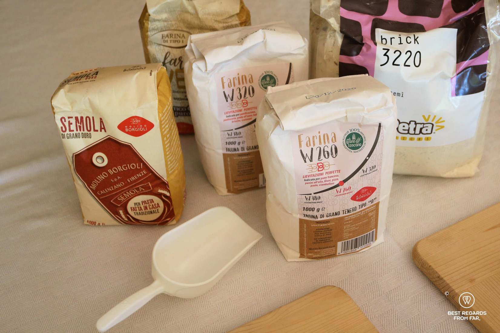 Different types of flour displayed on a table