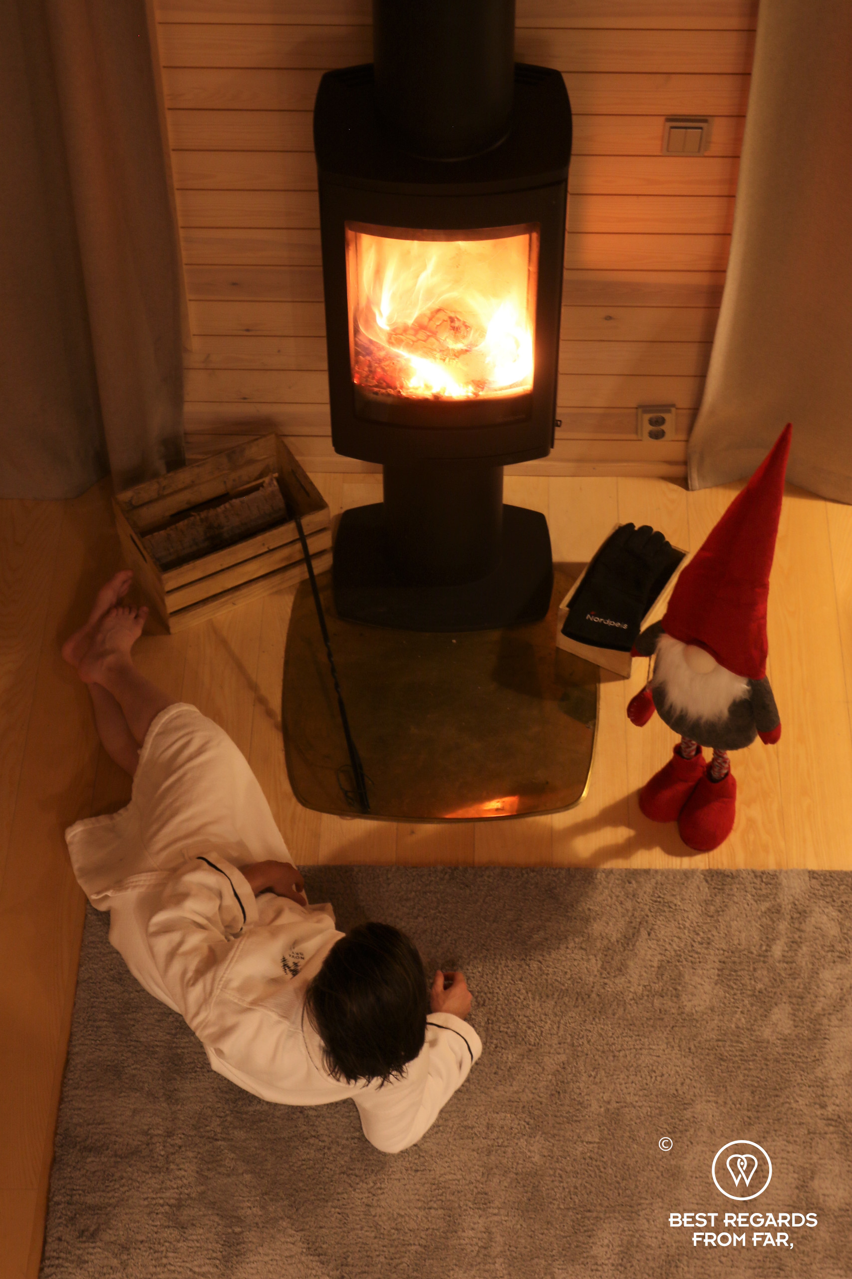 By the fire place with Santa at Nova skyland hotel, Rovaniemi